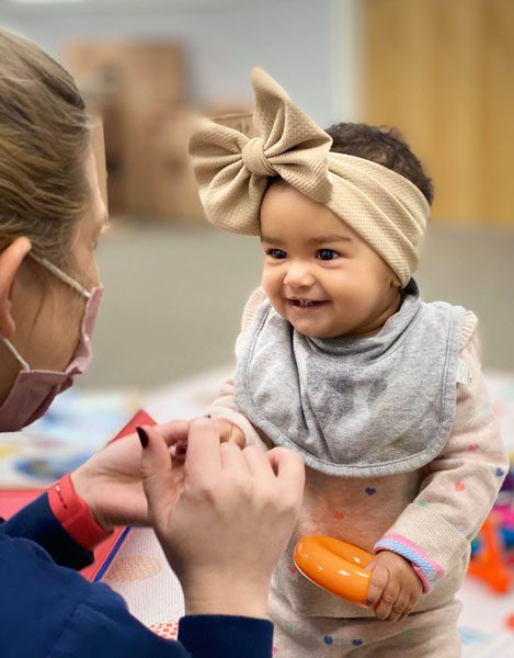 A Little Girl With a Brown Bow On Head